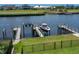 Waterfront property featuring a private boat dock with multiple boat and jet ski lifts at 433 Saint Julian Ln., Myrtle Beach, SC 29579