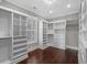 Walk-in closet features custom shelving and hardwood flooring at 433 Saint Julian Ln., Myrtle Beach, SC 29579