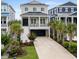 Two-story home featuring a 1-car garage, a manicured lawn, and lush landscaping, and a metal roof at 433 Saint Julian Ln., Myrtle Beach, SC 29579