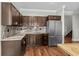 Kitchen featuring stainless steel appliances, wooden cabinets, granite countertops and hardwood floors at 433 Saint Julian Ln., Myrtle Beach, SC 29579