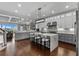 Modern kitchen featuring an island with counter seating, modern appliances, and hardwood floors at 433 Saint Julian Ln., Myrtle Beach, SC 29579