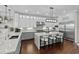 This is a spacious kitchen with stainless steel appliances, a center island, and elegant white cabinetry at 433 Saint Julian Ln., Myrtle Beach, SC 29579