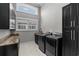 Laundry room features black cabinets, granite counters, and washer/dryer at 433 Saint Julian Ln., Myrtle Beach, SC 29579
