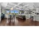 Open-concept living room with coffered ceilings, a modern fireplace, and access to the outdoor space at 433 Saint Julian Ln., Myrtle Beach, SC 29579