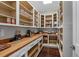 A well-organized walk-in pantry with custom shelving and ample storage space for all your kitchen needs at 433 Saint Julian Ln., Myrtle Beach, SC 29579