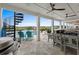 Spacious covered patio with ceiling fans, table seating, an outdoor kitchen and outdoor living space at 433 Saint Julian Ln., Myrtle Beach, SC 29579