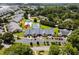 Aerial view of community featuring townhomes, community pool and tennis courts at 4648 Lightkeepers Way # 39A, Little River, SC 29566