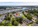 Wide aerial view of community showcasing pool, harbor, nearby lakes, and surrounding landscapes at 4648 Lightkeepers Way # 39A, Little River, SC 29566