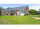 Expansive backyard with lush green lawn, ideal for outdoor activities and enjoying the surroundings at 4648 Lightkeepers Way # 39A, Little River, SC 29566