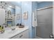 Well-lit bathroom featuring a vanity, mirror, and a refreshing shower with a glass door at 4648 Lightkeepers Way # 39A, Little River, SC 29566