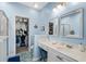 Bright bathroom with vanity, drawers, and walk-in closet space for organizing your wardrobe at 4648 Lightkeepers Way # 39A, Little River, SC 29566