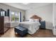 Charming bedroom featuring a decorative headboard, hardwood floors, and ample natural light at 4648 Lightkeepers Way # 39A, Little River, SC 29566
