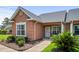 Charming, single story townhome featuring a quaint porch and well-maintained landscaping at 4648 Lightkeepers Way # 39A, Little River, SC 29566