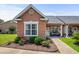 Charming villa exterior with manicured landscaping and cozy front porch seating at 4648 Lightkeepers Way # 39A, Little River, SC 29566
