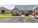 Charming townhome exterior with manicured landscaping and assigned parking at 4648 Lightkeepers Way # 39A, Little River, SC 29566