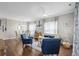 Open-concept living room featuring hardwood floors, neutral walls, and stylish coastal decor at 4648 Lightkeepers Way # 39A, Little River, SC 29566
