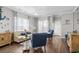 Bright living room featuring hardwood floors, large windows and stylish decor at 4648 Lightkeepers Way # 39A, Little River, SC 29566