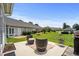 Cozy patio area with outdoor seating and grill, perfect for relaxation and entertaining at 4648 Lightkeepers Way # 39A, Little River, SC 29566