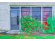 The back exterior features large windows surrounded by lovely flowering bushes at 510 Fairwood Lakes Dr. # 15-I, Myrtle Beach, SC 29588