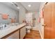 Bathroom featuring a single sink vanity, shower with curtain, and wood-look flooring at 510 Fairwood Lakes Dr. # 15-I, Myrtle Beach, SC 29588
