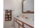 Bathroom featuring a single sink vanity with white countertop and a framed mirror at 510 Fairwood Lakes Dr. # 15-I, Myrtle Beach, SC 29588