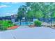 Community pool surrounded by chairs and landscaped flower beds at 510 Fairwood Lakes Dr. # 15-I, Myrtle Beach, SC 29588