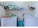Functional laundry room with a washer, dryer, and shelving for storage at 510 Fairwood Lakes Dr. # 15-I, Myrtle Beach, SC 29588