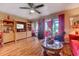 Bright living area featuring a ceiling fan, entertainment center and glass doors to the outside at 510 Fairwood Lakes Dr. # 15-I, Myrtle Beach, SC 29588