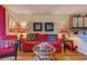 Cozy living room with elegant decor, a comfortable red sofa, and stylish accent pieces at 510 Fairwood Lakes Dr. # 15-I, Myrtle Beach, SC 29588