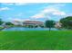 Scenic view of a community pond with a fountain and building backdrop at 510 Fairwood Lakes Dr. # 15-I, Myrtle Beach, SC 29588