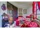 Bright sunroom with red seating, large windows, and decorative accents at 510 Fairwood Lakes Dr. # 15-I, Myrtle Beach, SC 29588