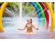 Young girl in the water at the water park with colorful arches and bright sunlight at 510 Fairwood Lakes Dr. # 15-I, Myrtle Beach, SC 29588
