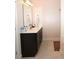 Bathroom vanity with dark cabinets and light countertops at 541 Irees Way, Longs, SC 29568
