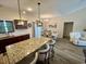 Well-appointed kitchen with granite countertops, stainless steel appliances, and breakfast bar seating at 541 Irees Way, Longs, SC 29568