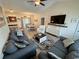 Inviting living space with vaulted ceilings, modern furniture, and a seamless flow to the dining area at 541 Irees Way, Longs, SC 29568