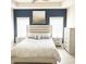Serene bedroom with a modern bed frame, calming paint colors, and plenty of natural light at 541 Irees Way, Longs, SC 29568
