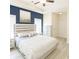 A bright and spacious main bedroom with modern furniture, neutral tones, and generous closet space at 541 Irees Way, Longs, SC 29568
