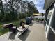 Spacious concrete patio featuring an outdoor dining area and outdoor seating at 541 Irees Way, Longs, SC 29568
