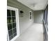 View of screened porch with ceiling fan, outdoor lighting, and access to the backyard at 541 Irees Way, Longs, SC 29568