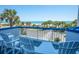 Balcony with white Adirondack chairs overlooking the beach and ocean views at 5511 Ocean Blvd. N # 805, Myrtle Beach, SC 29577