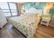 Inviting bedroom with beach-themed decor, a large window, and ample natural light at 5511 Ocean Blvd. N # 805, Myrtle Beach, SC 29577