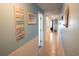 Long hallway with beach-themed decorations and access to multiple rooms at 5511 Ocean Blvd. N # 805, Myrtle Beach, SC 29577