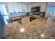 Bright kitchen featuring granite countertops, stainless steel appliances, and ample cabinet space at 5511 Ocean Blvd. N # 805, Myrtle Beach, SC 29577