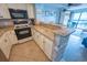 Well-equipped kitchen featuring granite countertops, modern appliances, and bar seating at 5511 Ocean Blvd. N # 805, Myrtle Beach, SC 29577