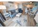 Bright and airy living room with comfortable seating, nautical decor, and easy access to the kitchen at 5511 Ocean Blvd. N # 805, Myrtle Beach, SC 29577