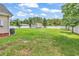Spacious backyard enclosed by a white fence, featuring a shed and lush greenery at 553 Fox Chase Dr., Conway, SC 29527