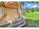 Wooden deck overlooking an expansive, well-maintained lawn and fenced yard at 553 Fox Chase Dr., Conway, SC 29527