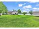Expansive backyard featuring a white fence, lush green lawn, and ample space for outdoor activities at 553 Fox Chase Dr., Conway, SC 29527