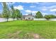 Large, fenced backyard with a green lawn and mature trees, perfect for recreation and privacy at 553 Fox Chase Dr., Conway, SC 29527
