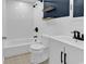 Updated bathroom with a tiled shower and tub, a modern vanity, black hardware, and stylish flooring at 553 Fox Chase Dr., Conway, SC 29527